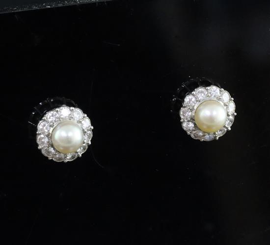 A pair of mid 20th century white and yellow gold, cultured pearl and diamond set circular cluster ear studs, 10mm.